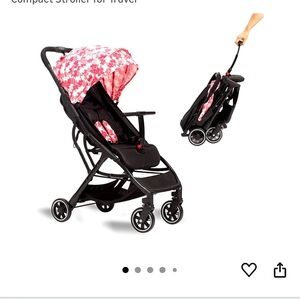 Compact Black and Pink Stroller